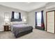 Spacious bedroom with a comfy bed and plenty of natural light at 5704 E 16Th St, Indianapolis, IN 46218