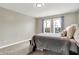 Well-lit bedroom with a full bed and window views at 5704 E 16Th St, Indianapolis, IN 46218