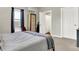 Bright bedroom with a queen bed, carpet flooring and en-suite bathroom at 5704 E 16Th St, Indianapolis, IN 46218