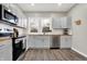 Modern kitchen with stainless steel appliances and wood countertops at 5704 E 16Th St, Indianapolis, IN 46218