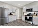 Modern kitchen with stainless steel appliances and wood countertops at 5704 E 16Th St, Indianapolis, IN 46218