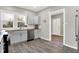Modern kitchen with stainless steel appliances and wood countertops at 5704 E 16Th St, Indianapolis, IN 46218