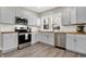 Modern kitchen featuring stainless steel appliances and wood countertops at 5704 E 16Th St, Indianapolis, IN 46218