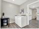 Laundry room with washer, dryer, and extra storage space at 5704 E 16Th St, Indianapolis, IN 46218