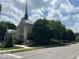 Stone church with a tall steeple at 5844 Central Ave, Indianapolis, IN 46220