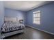 Bedroom with a double bed and light blue walls at 6264 Whitaker Farms Dr, Indianapolis, IN 46237