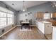 Charming dining area with hardwood floors and a modern chandelier at 6264 Whitaker Farms Dr, Indianapolis, IN 46237