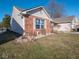 Side view of the home showcasing brick and siding at 6264 Whitaker Farms Dr, Indianapolis, IN 46237