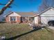 Front view of the house with landscaping at 6264 Whitaker Farms Dr, Indianapolis, IN 46237