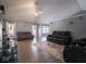 Open living room featuring wood-look floors and furniture at 6264 Whitaker Farms Dr, Indianapolis, IN 46237