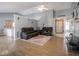 Spacious living room with vaulted ceiling, hardwood floors, and a large flat-screen TV at 6264 Whitaker Farms Dr, Indianapolis, IN 46237