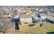 Aerial backyard view featuring a deck with outdoor seating, a hot tub, and a well-maintained lawn at 6623 Pasco Ln, Plainfield, IN 46168