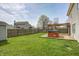 Backyard featuring a shed and pergola-covered deck with a hot tub at 6623 Pasco Ln, Plainfield, IN 46168