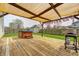 Backyard deck with hot tub, grill, and pergola at 6623 Pasco Ln, Plainfield, IN 46168