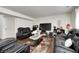 Basement living room offers a cozy entertainment space, with comfortable seating and a large screen TV at 6623 Pasco Ln, Plainfield, IN 46168