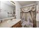 Bathroom featuring a swan-themed shower curtain, decorative accents, and vanity sink at 6623 Pasco Ln, Plainfield, IN 46168