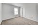 Clean, carpeted bedroom with a window and a door at 6623 Pasco Ln, Plainfield, IN 46168