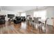 Spacious open-concept room blends dining and living areas, showcasing modern design and a comfortable setting at 6623 Pasco Ln, Plainfield, IN 46168