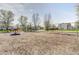 Outdoor community playground with swings, roundabout, and play structures at 6623 Pasco Ln, Plainfield, IN 46168