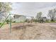 Community playground with swings and a jungle gym area surrounded by trees and neighborhood homes at 6623 Pasco Ln, Plainfield, IN 46168
