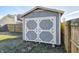 Backyard featuring a stylish shed with white trim, offering practical storage space and enhancing backyard aesthetics at 6623 Pasco Ln, Plainfield, IN 46168