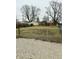 Large backyard with gravel area and chain link fence at 733 S Emerson Ave, Indianapolis, IN 46203