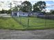 Expansive backyard with a chain-link fence, perfect for outdoor activities and privacy at 733 S Emerson Ave, Indianapolis, IN 46203