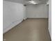 Unfinished basement with painted concrete floor and white walls at 733 S Emerson Ave, Indianapolis, IN 46203