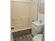 Clean bathroom with stone-look accents and vinyl flooring at 733 S Emerson Ave, Indianapolis, IN 46203