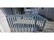Small front porch with gray railings and steps at 733 S Emerson Ave, Indianapolis, IN 46203