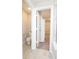 Bright bathroom with white fixtures and a view into a walk-in closet at 9812 Ridgecrest Ln, McCordsville, IN 46055