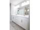 Modern bathroom features a double sink vanity, quartz countertops, and a walk-in shower at 9812 Ridgecrest Ln, McCordsville, IN 46055