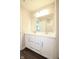Contemporary bathroom featuring double sinks and a large mirror with modern lighting at 9812 Ridgecrest Ln, McCordsville, IN 46055