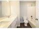 Well-lit bathroom featuring a shower-tub combo and a toilet with dual vanities at 9812 Ridgecrest Ln, McCordsville, IN 46055