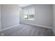 Bedroom with carpet flooring, window, and a doorway at 9812 Ridgecrest Ln, McCordsville, IN 46055
