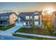 Two-story home with two-car garage, well-kept lawn, and landscaping nestled between other homes in a cozy neighborhood at 9812 Ridgecrest Ln, McCordsville, IN 46055