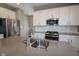 Modern kitchen with stainless steel appliances, quartz countertops, and white cabinetry at 9812 Ridgecrest Ln, McCordsville, IN 46055