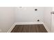 Neat laundry room has sleek wood-look floors and easy access to connections at 9812 Ridgecrest Ln, McCordsville, IN 46055