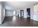 Spacious living room showcasing an open floor plan with a fireplace and access to other rooms at 9812 Ridgecrest Ln, McCordsville, IN 46055