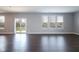Bright living room with vinyl floors and sliding doors that lead to the backyard at 9812 Ridgecrest Ln, McCordsville, IN 46055