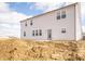 Backyard of a new construction home showcases a modern exterior, ready for personalized landscaping and outdoor enjoyment at 101 Ames Dr, Whiteland, IN 46184