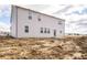 New construction home's rear elevation and unfinished yard offers a canvas for your landscaping dreams at 101 Ames Dr, Whiteland, IN 46184