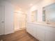 Bright bathroom features a shower with glass doors and a double sink vanity at 101 Ames Dr, Whiteland, IN 46184