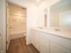 Modern bathroom features double sinks, white cabinets, and a shower-tub combination for a spa-like experience at 101 Ames Dr, Whiteland, IN 46184