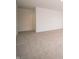A large, carpeted bedroom is well-lit by a recessed light and a window at 101 Ames Dr, Whiteland, IN 46184