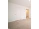 Spacious bedroom with neutral carpet, features an adjacent doorway plus closet for optimal organization at 101 Ames Dr, Whiteland, IN 46184