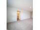 Carpeted bedroom with an entrance to a bathroom featuring a vanity at 101 Ames Dr, Whiteland, IN 46184