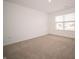 Bedroom features a large window, carpeted floors, and light-colored walls at 101 Ames Dr, Whiteland, IN 46184