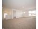 Upstairs bonus room is carpeted and gets natural light from a window at 101 Ames Dr, Whiteland, IN 46184