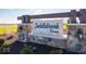 Saddlebrook Farms community entrance sign with landscaping and lighting at 101 Ames Dr, Whiteland, IN 46184